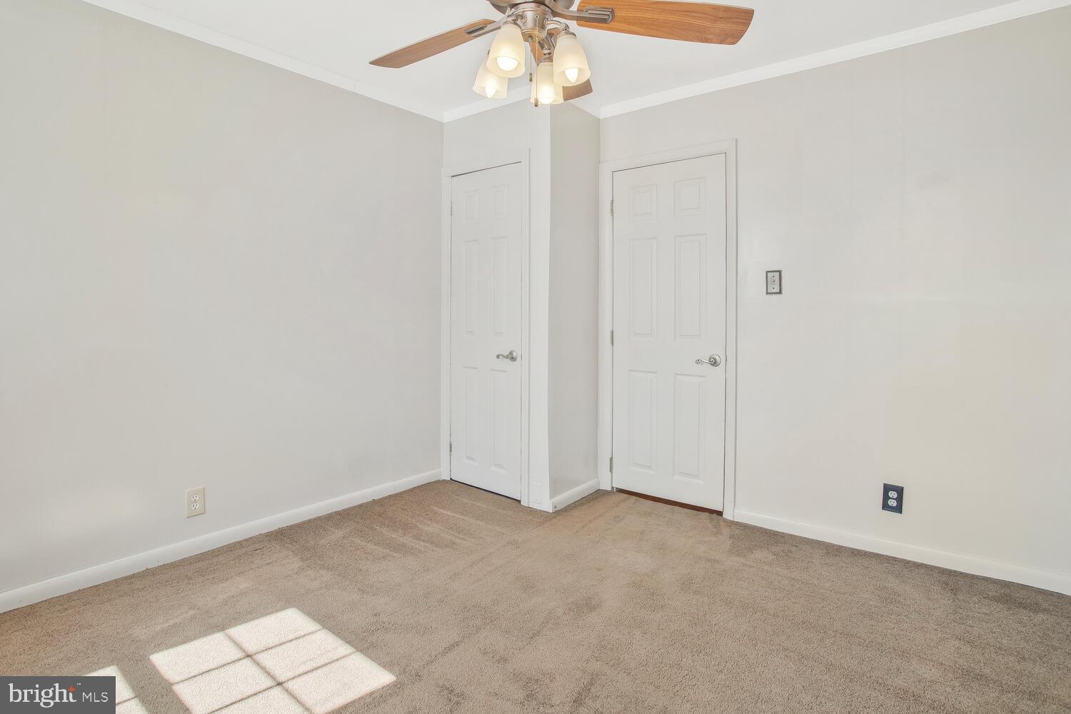 1148 Roland Heights Avenue Baltimore, MD 21211 - Photo 19 of 38 Back bedroom with ceiling fan and carpet