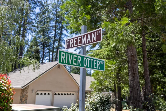 a sign board with a yard