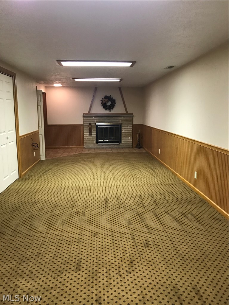 4895 4th Street Northwest Canton, OH 44708 - Photo 20 of 31 Large family/rec room in basement with 2nd wood burning fireplace