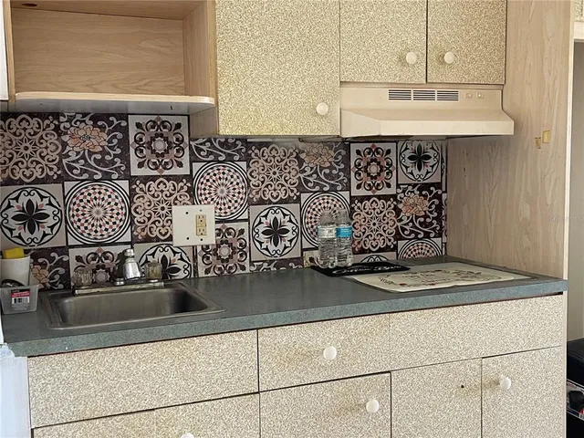 a bathroom with a sink and granite