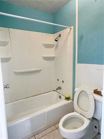 a bathroom with a sink a toilet and a bathtub