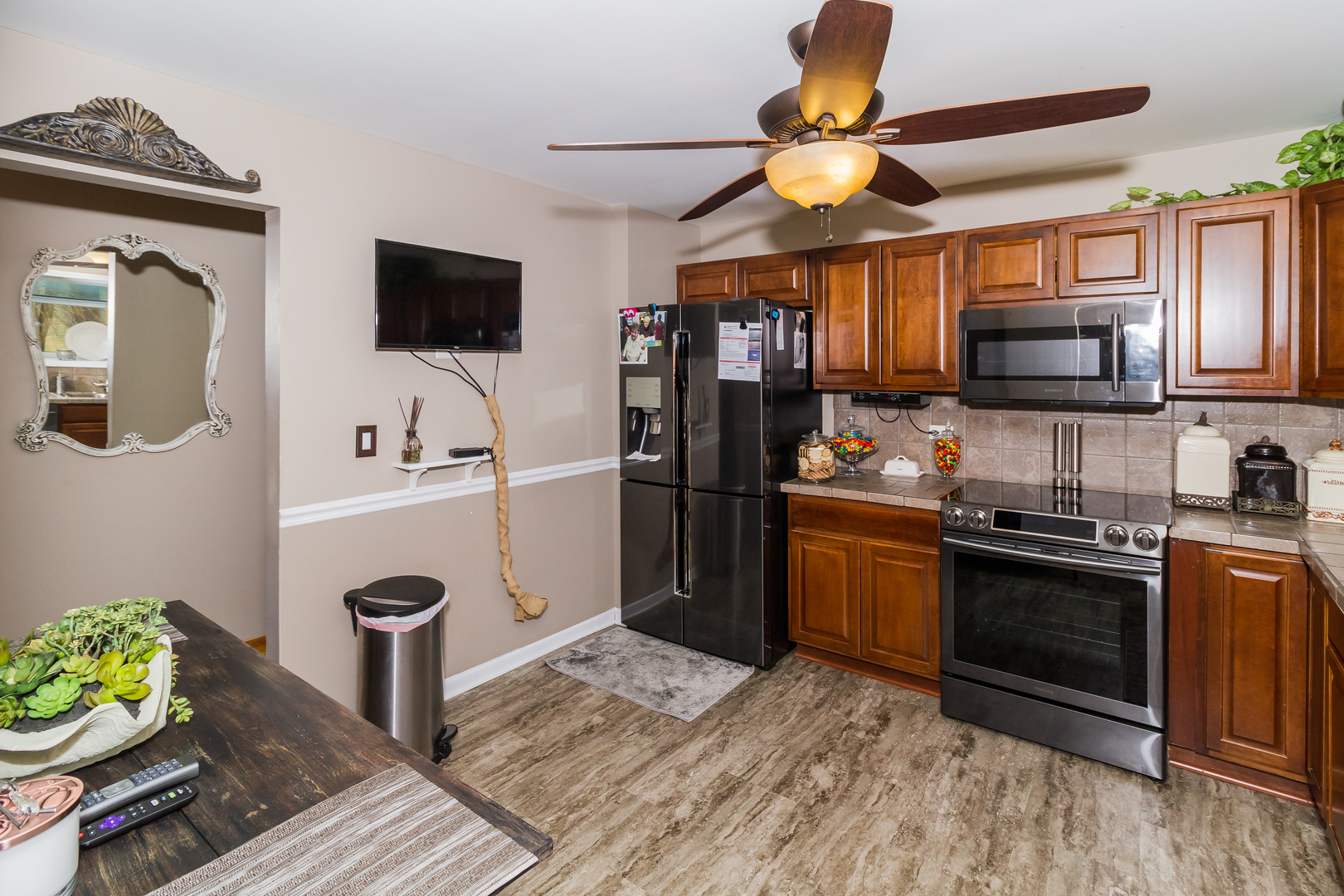 33 Oakview Road Matteson, IL 60443 - Photo 11 of 31 a kitchen with stainless steel appliances granite countertop a stove refrigerator and microwave