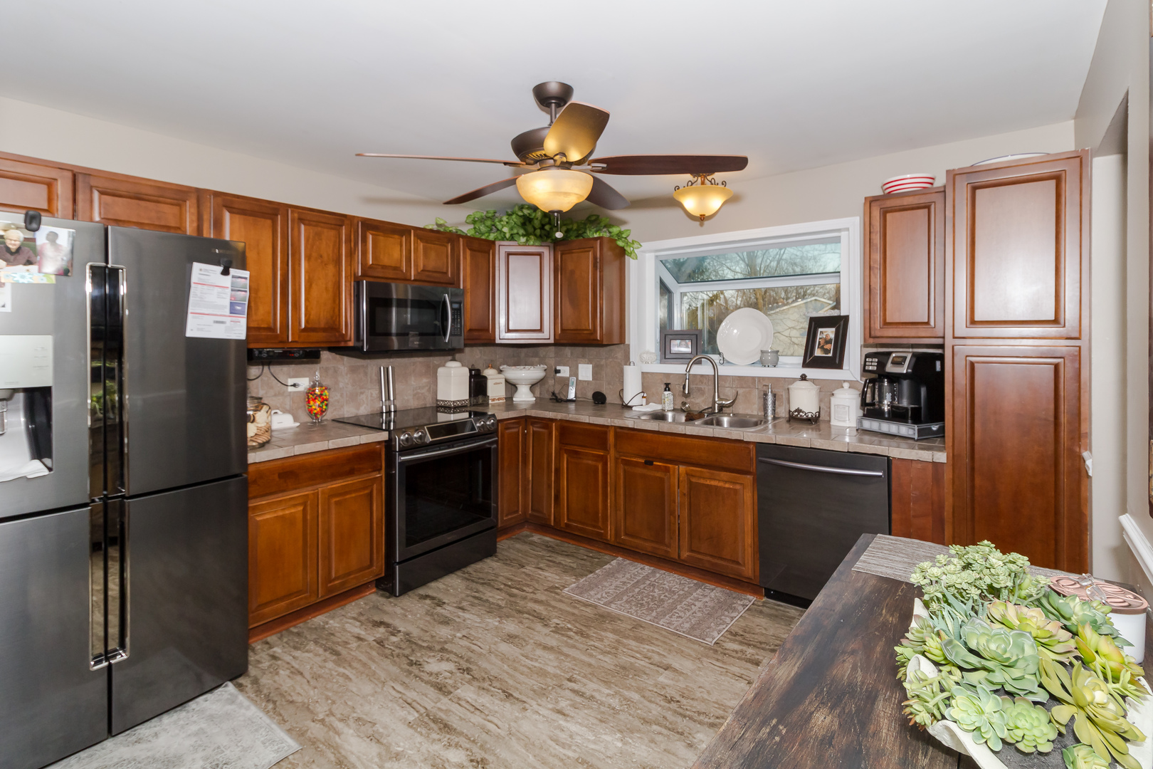 33 Oakview Road Matteson, IL 60443 - Photo 12 of 31 a kitchen with stainless steel appliances granite countertop a refrigerator a stove top oven a sink and dishwasher