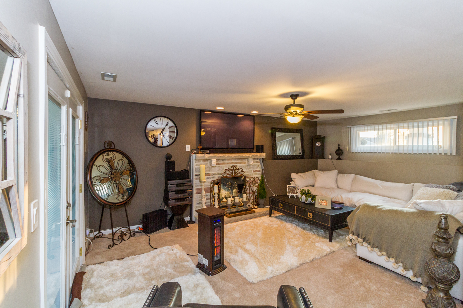 33 Oakview Road Matteson, IL 60443 - Photo 24 of 31 a living room with furniture a clock and a fireplace