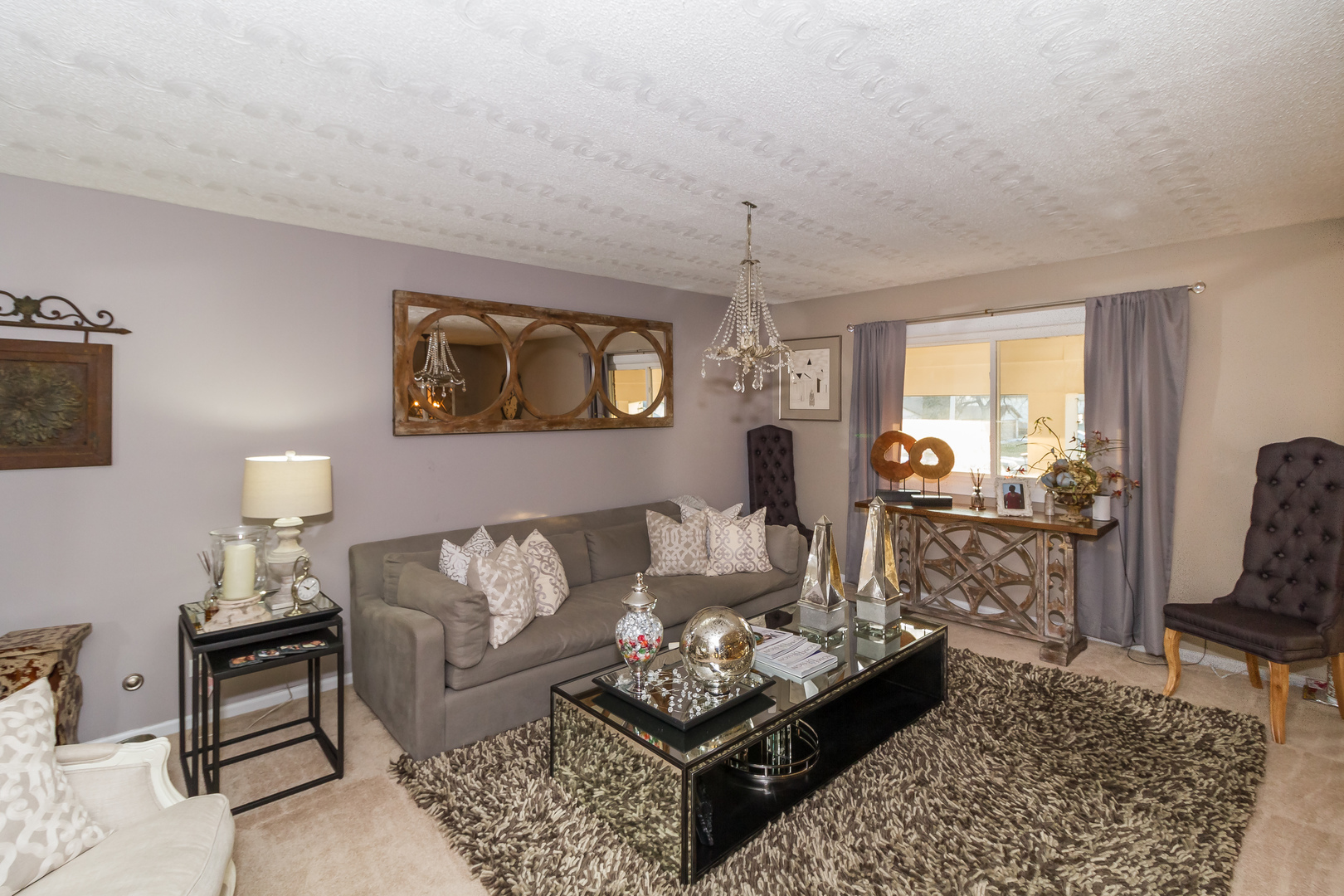 33 Oakview Road Matteson, IL 60443 - Photo 6 of 31 a living room with furniture a rug and a chandelier