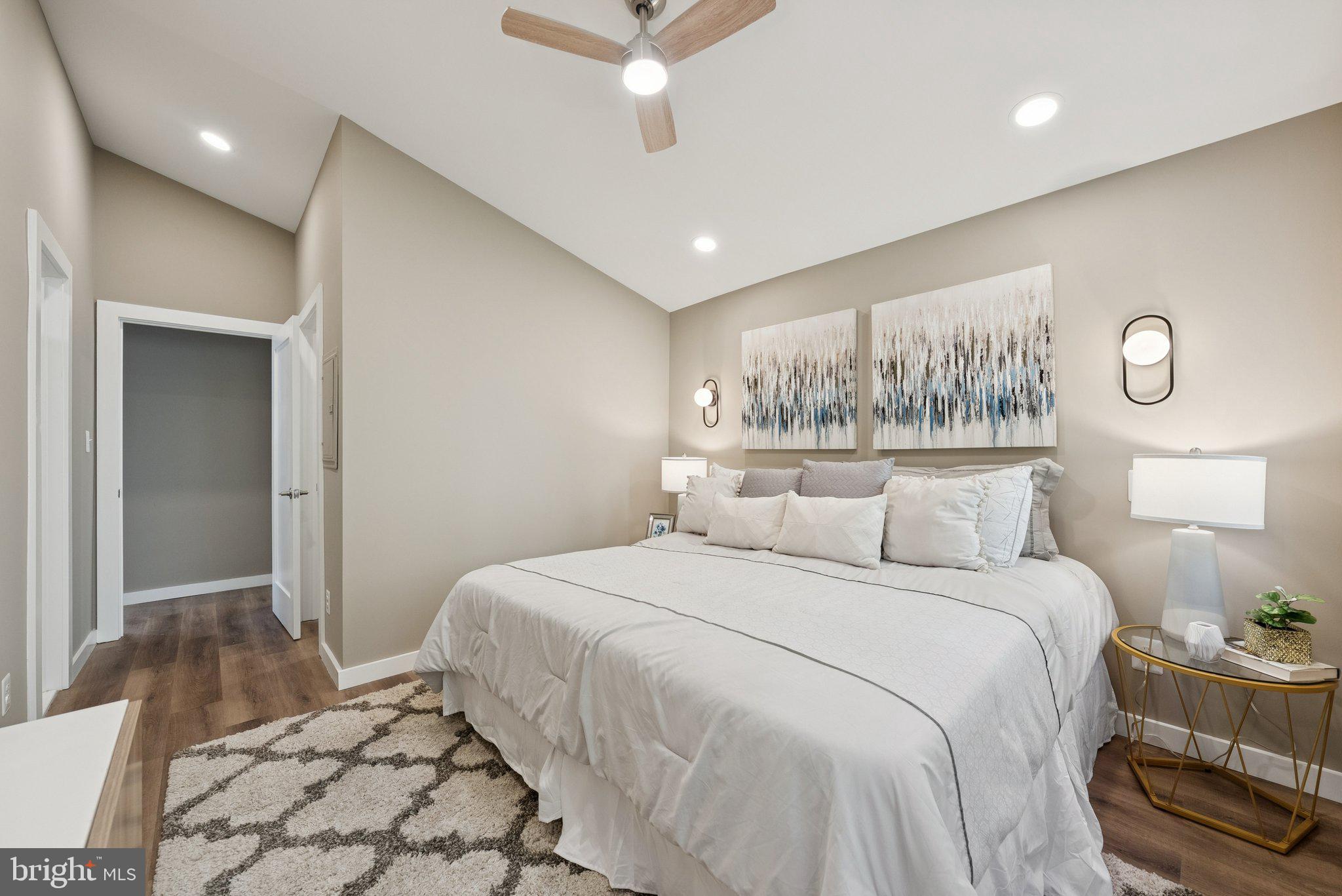 11511 Highview Avenue Silver Spring, MD 20902 - Photo 24 of 39 a bedroom with a large bed and a chandelier