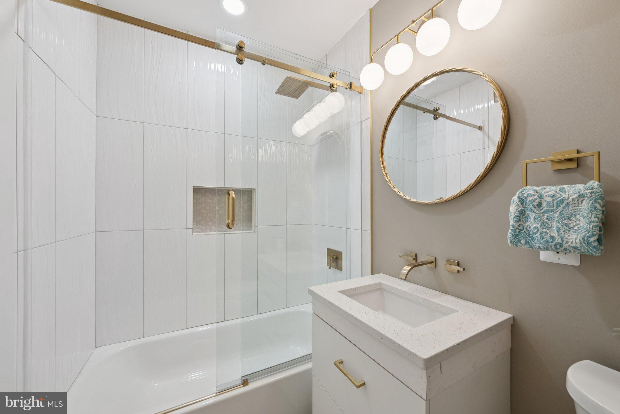 11511 Highview Avenue Silver Spring, MD 20902 - Photo 27 of 39 a bathroom with a sink a mirror and a shower