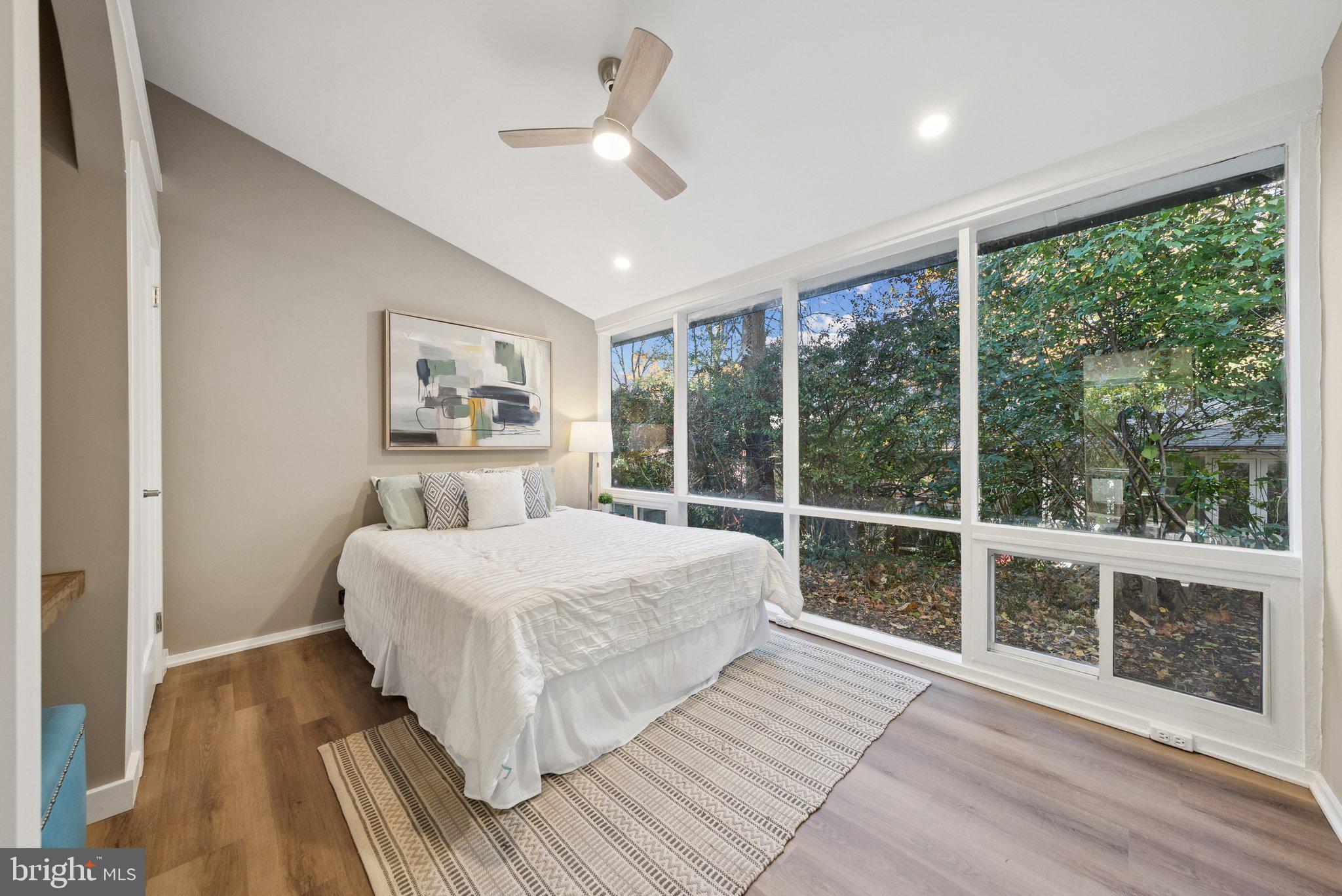 11511 Highview Avenue Silver Spring, MD 20902 - Photo 29 of 39 a bedroom with a large bed and a large window