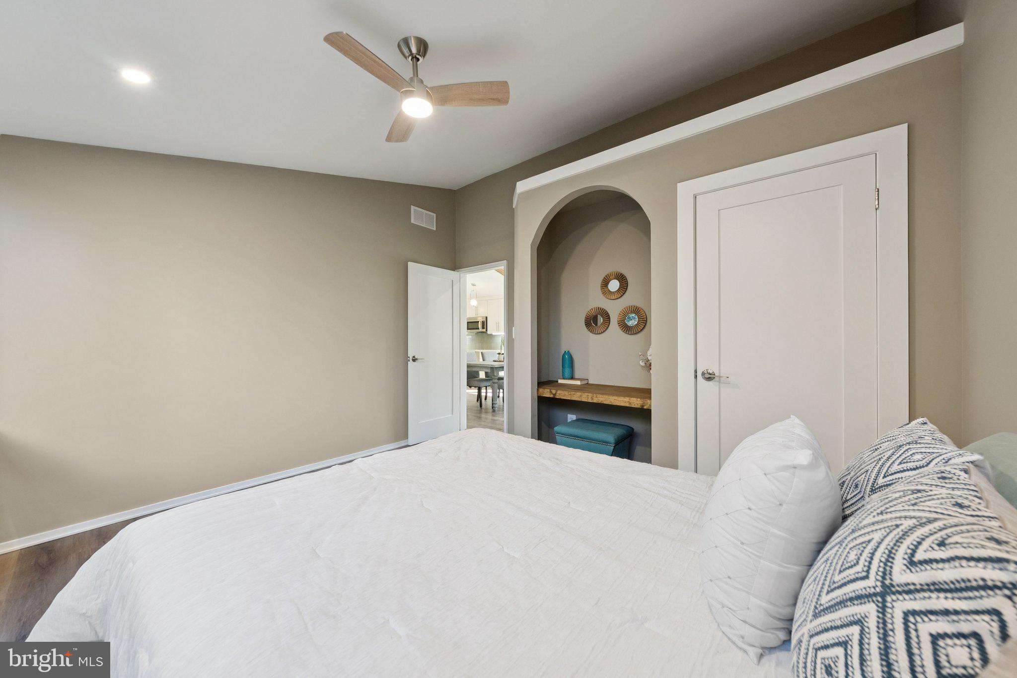 11511 Highview Avenue Silver Spring, MD 20902 - Photo 31 of 39 a bedroom with a bed and a chandelier