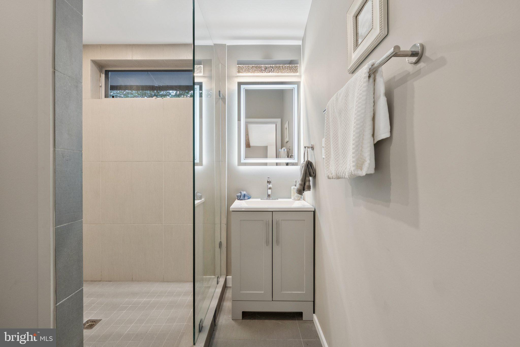 11511 Highview Avenue Silver Spring, MD 20902 - Photo 32 of 39 a bathroom with a sink and mirror
