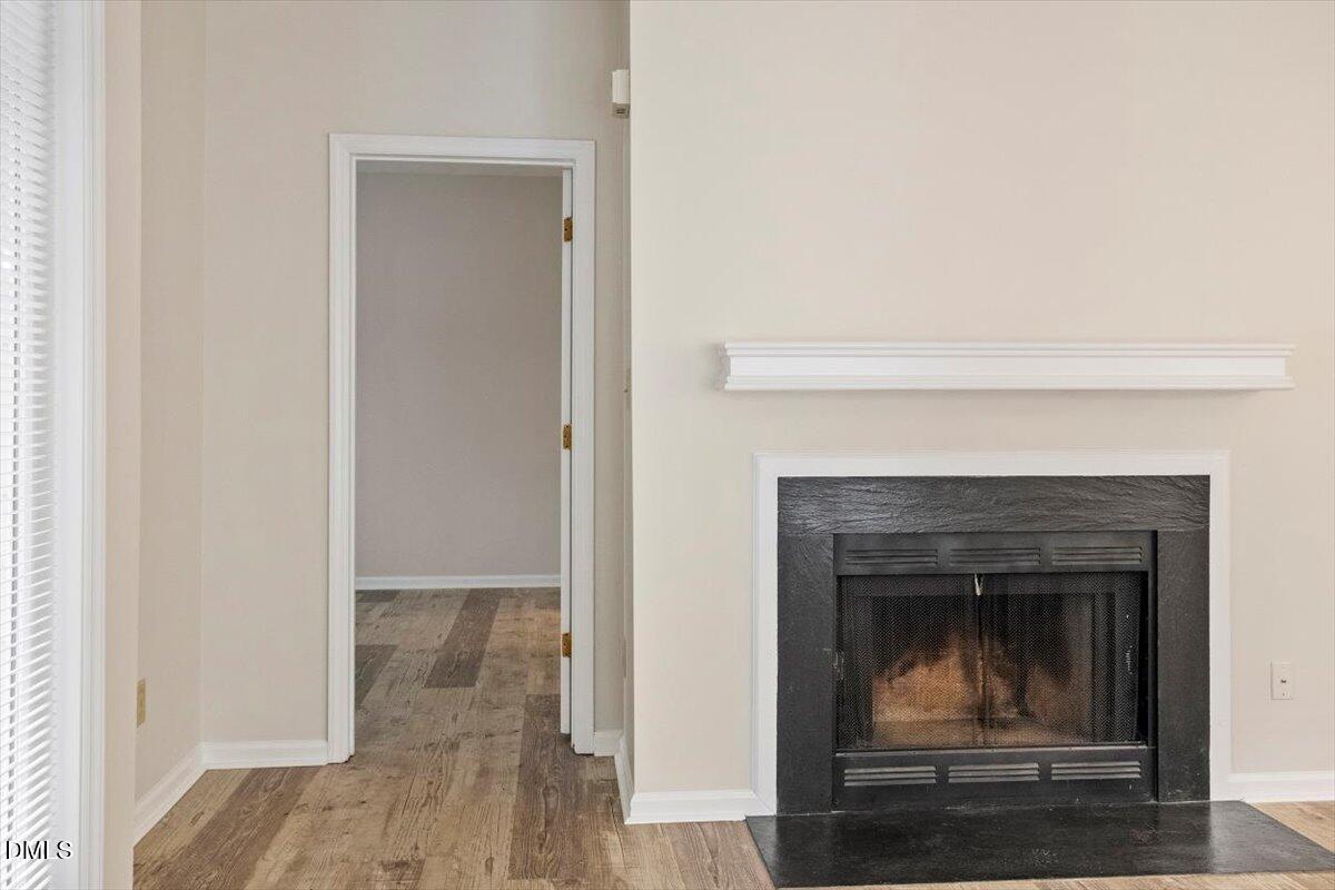 1001 Brighthurst Drive, Unit 106 Raleigh, NC 27605 - Photo 13 of 23 a living room with a fireplace