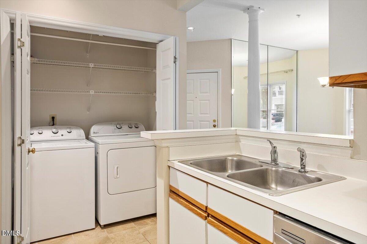 1001 Brighthurst Drive, Unit 106 Raleigh, NC 27605 - Photo 20 of 23 a utility room with dryer and washer