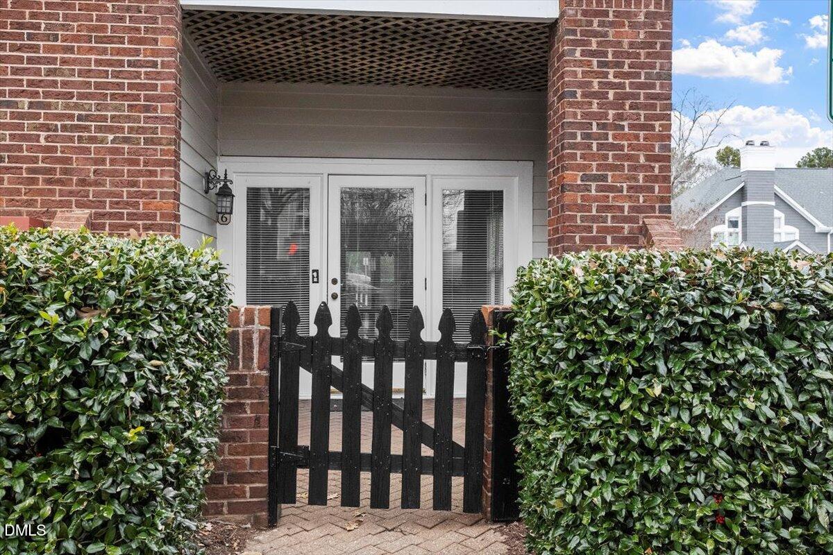 1001 Brighthurst Drive, Unit 106 Raleigh, NC 27605 - Photo 4 of 23 a view of a brick house with a large window