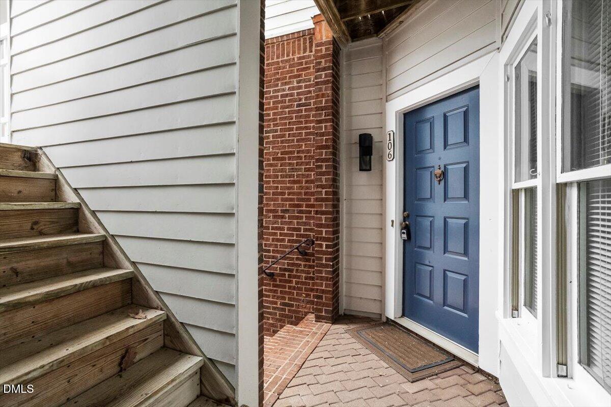 1001 Brighthurst Drive, Unit 106 Raleigh, NC 27605 - Photo 5 of 23 a view of an entryway with staircase