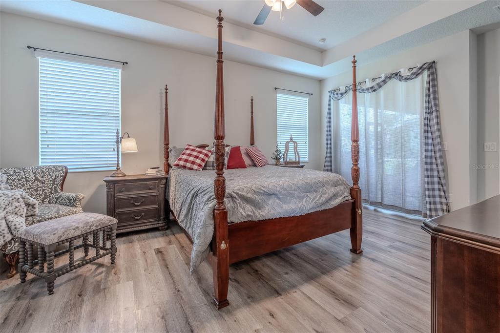 9224 Southwest 60th Ct Road Ocala, FL 34476 - Photo 27 of 55 a bedroom with a bed and a couch