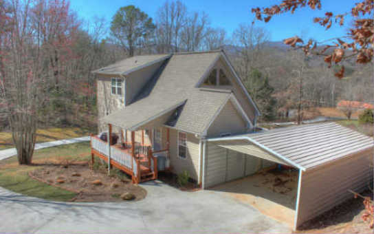 1503 Booger Hollow Road Blairsville, GA 30512 - Photo 1 of 1 a view of a house with a yard and large tree