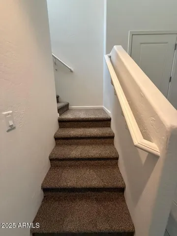 a spacious bathroom with a shower sink and mirror