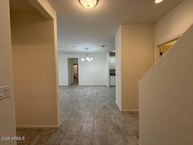 a view of a hallway with a bathroom