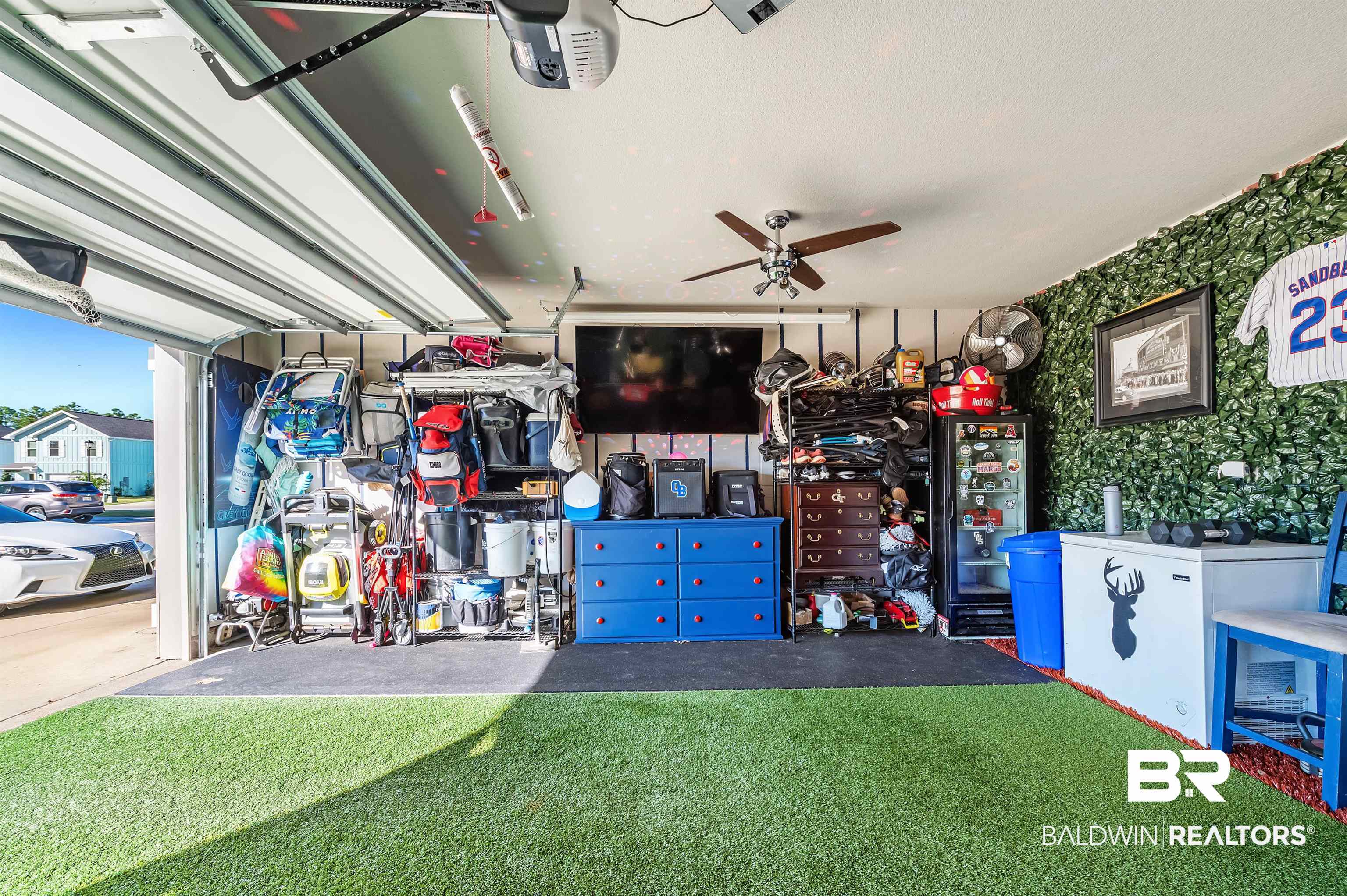 24549 Broken Sound Loop Orange Beach, AL 36561 - Photo 56 of 57 Garage featuring a yard and ceiling fan