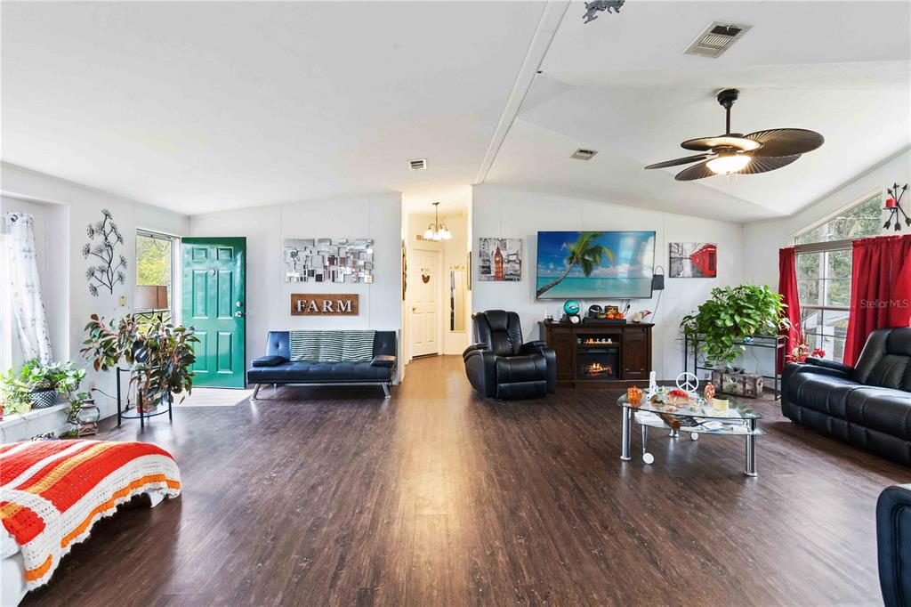 6701 Nova Road St. Cloud, FL 34771 - Photo 19 of 49 a living room with furniture and a large window