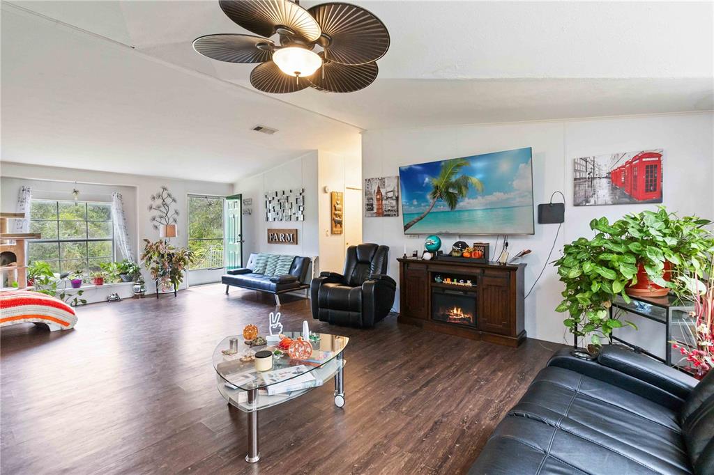 6701 Nova Road St. Cloud, FL 34771 - Photo 20 of 49 a living room with furniture and a large window