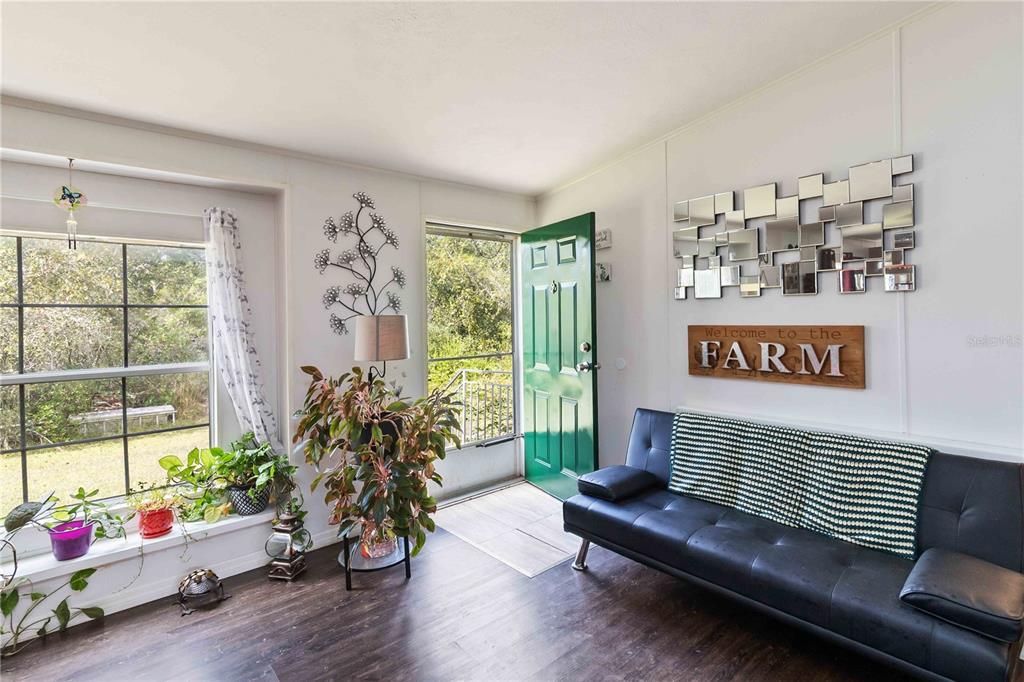 6701 Nova Road St. Cloud, FL 34771 - Photo 21 of 49 a living room with furniture window and wooden floor