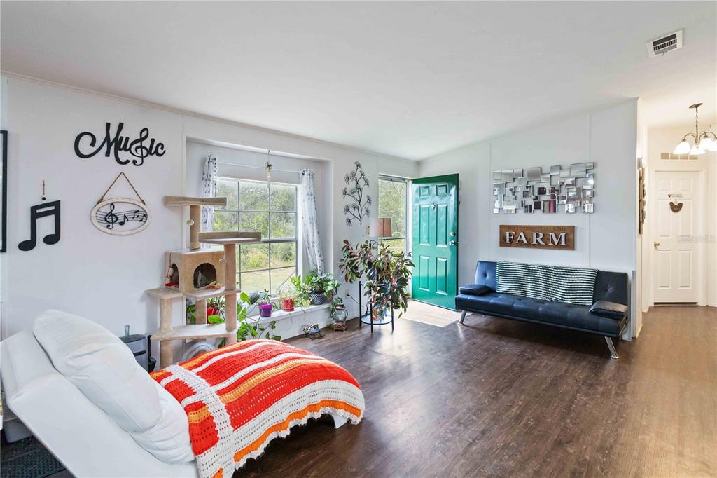 6701 Nova Road St. Cloud, FL 34771 - Photo 22 of 49 a living room with furniture and a large window