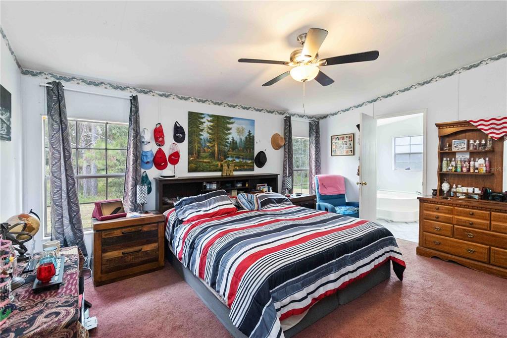 6701 Nova Road St. Cloud, FL 34771 - Photo 24 of 49 a bed room with a bed and a window