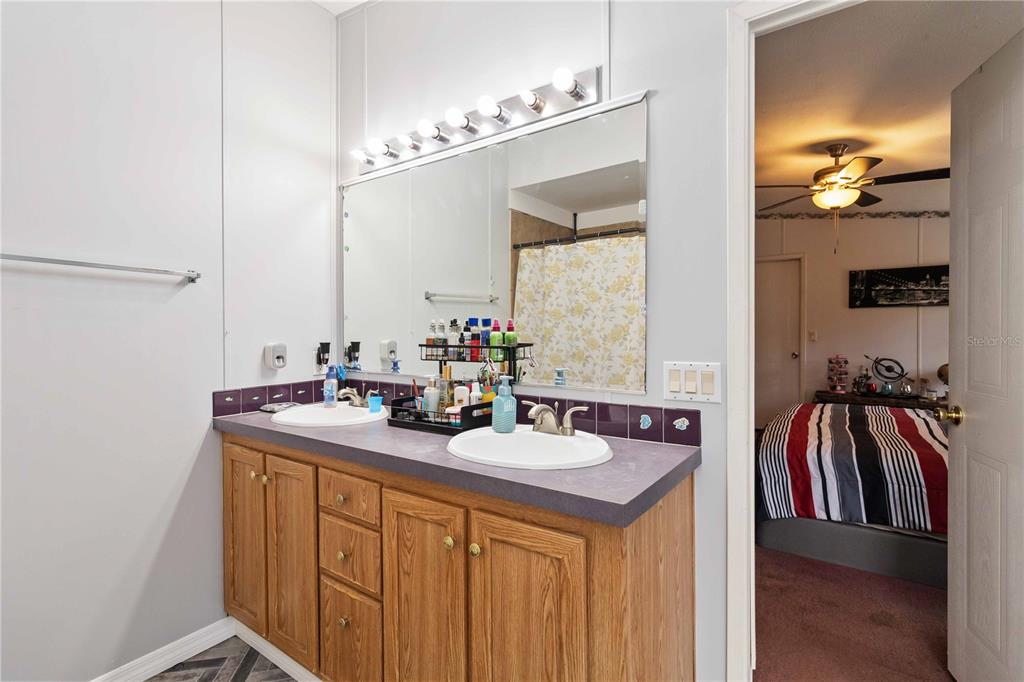 6701 Nova Road St. Cloud, FL 34771 - Photo 27 of 49 a bathroom with a sink and a mirror