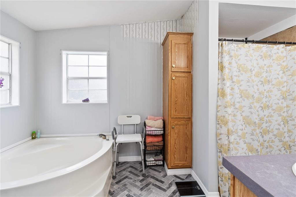 6701 Nova Road St. Cloud, FL 34771 - Photo 28 of 49 a bathroom with a tub and shower