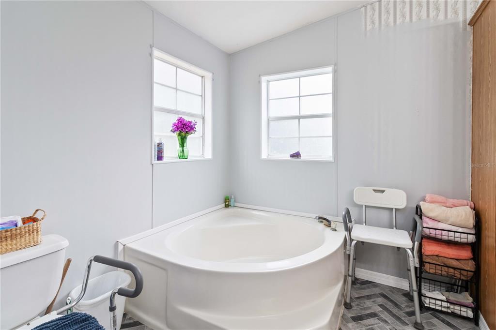 6701 Nova Road St. Cloud, FL 34771 - Photo 29 of 49 a white bath tub sitting next to a white sink