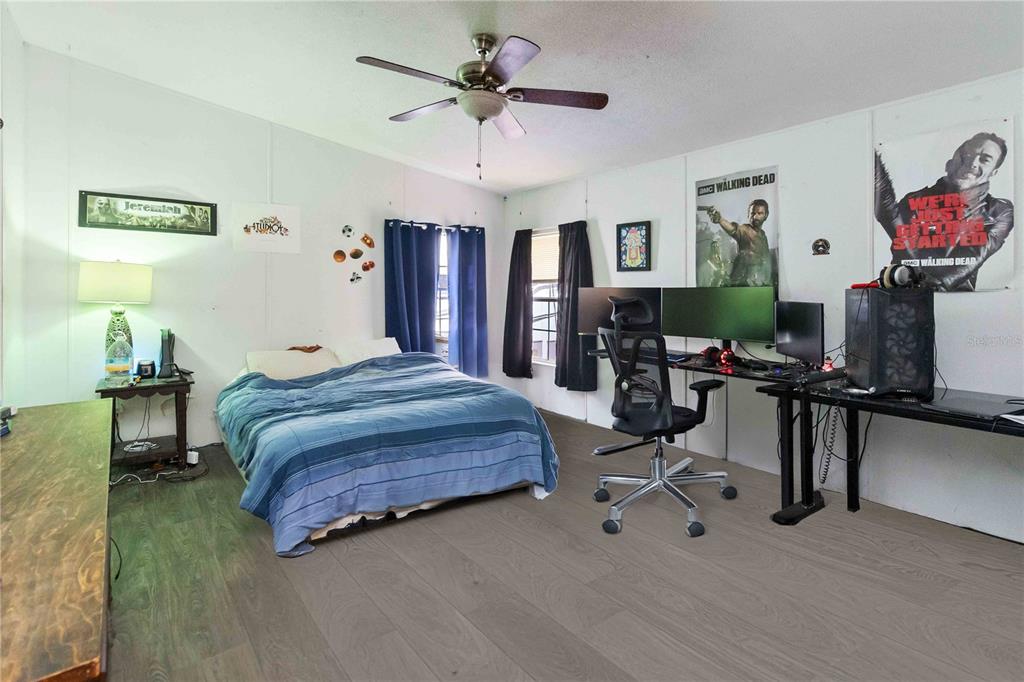 6701 Nova Road St. Cloud, FL 34771 - Photo 30 of 49 a bedroom with a bed gym equipment and view of living room