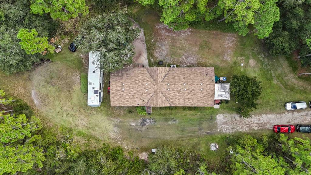 6701 Nova Road St. Cloud, FL 34771 - Photo 42 of 49 an aerial view of a house with a yard