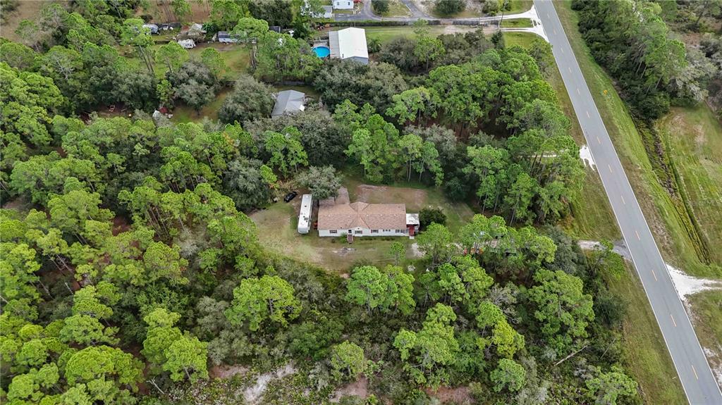 6701 Nova Road St. Cloud, FL 34771 - Photo 43 of 49 an aerial view of a house with a yard