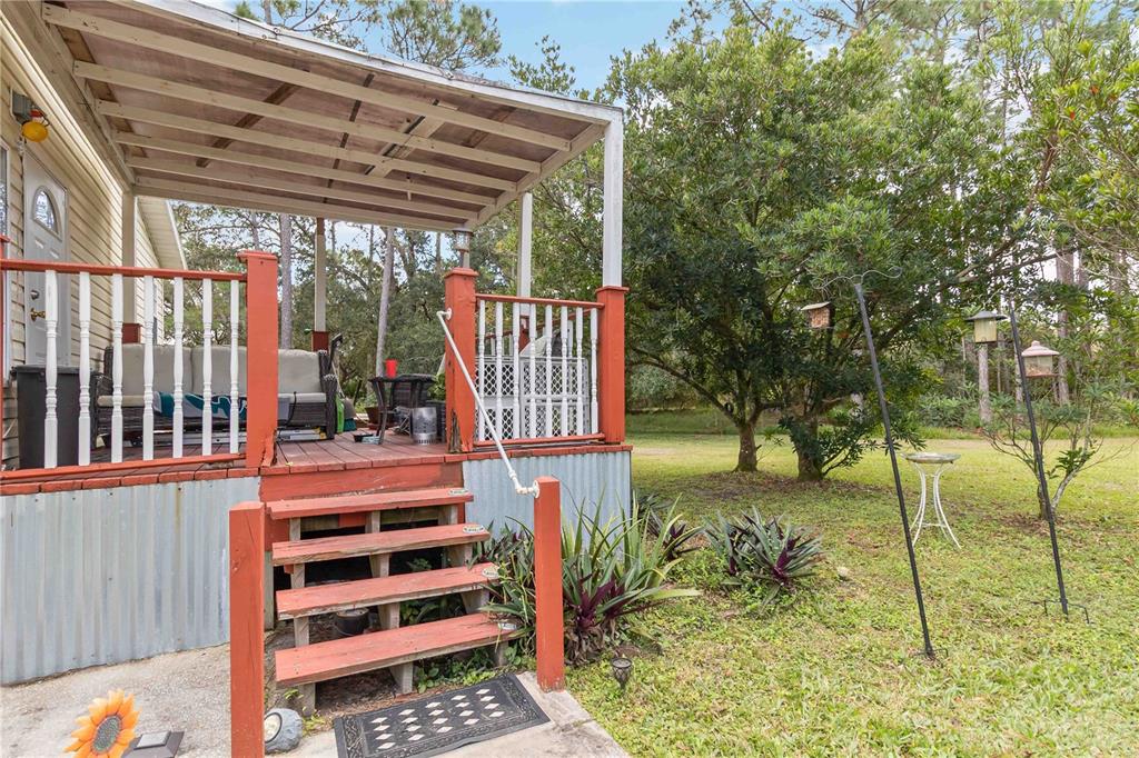 6701 Nova Road St. Cloud, FL 34771 - Photo 5 of 49 a view of entryway with a garden