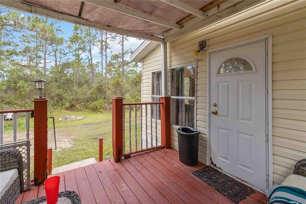 6701 Nova Road St. Cloud, FL 34771 - Photo 6 of 49 a view of a balcony with wooden floor