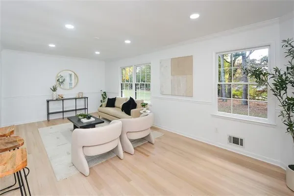 a view of a dining room with furniture window and wooden floor