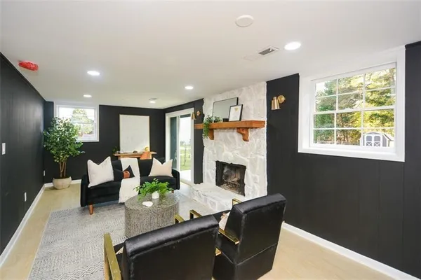 a bedroom with a bed and a large mirror on the dresser