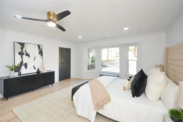 a bathroom with a shower a toilet and sink