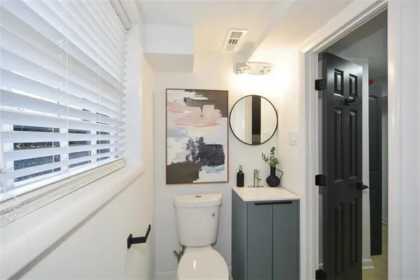 an aerial view of a house with a garden and a yard