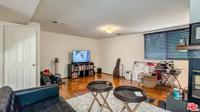 a room with furniture and a wooden floor