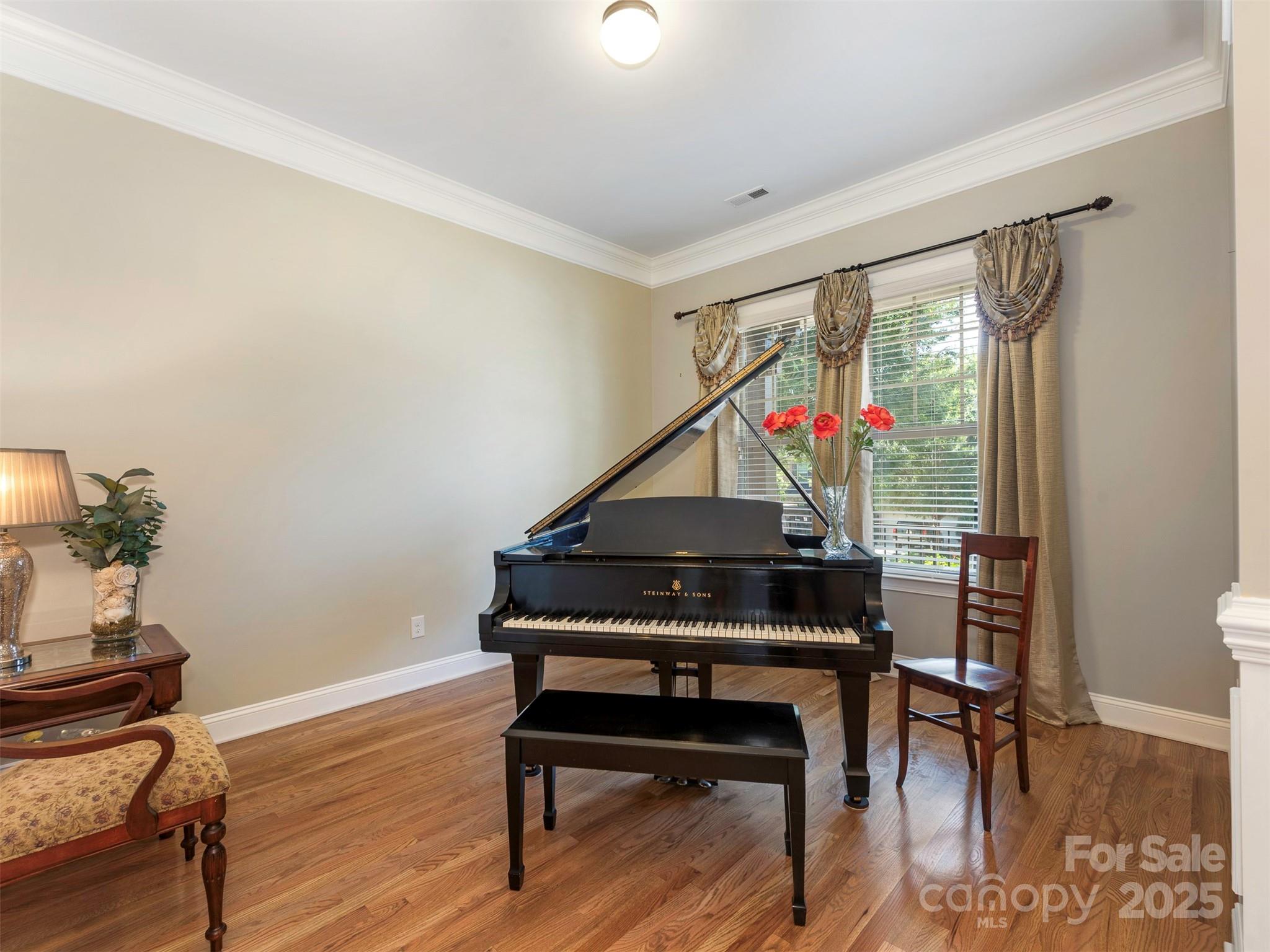 8062 Clems Branch Road Indian Land, SC 29707 - Photo 3 of 42 a room with furniture and a wooden floor