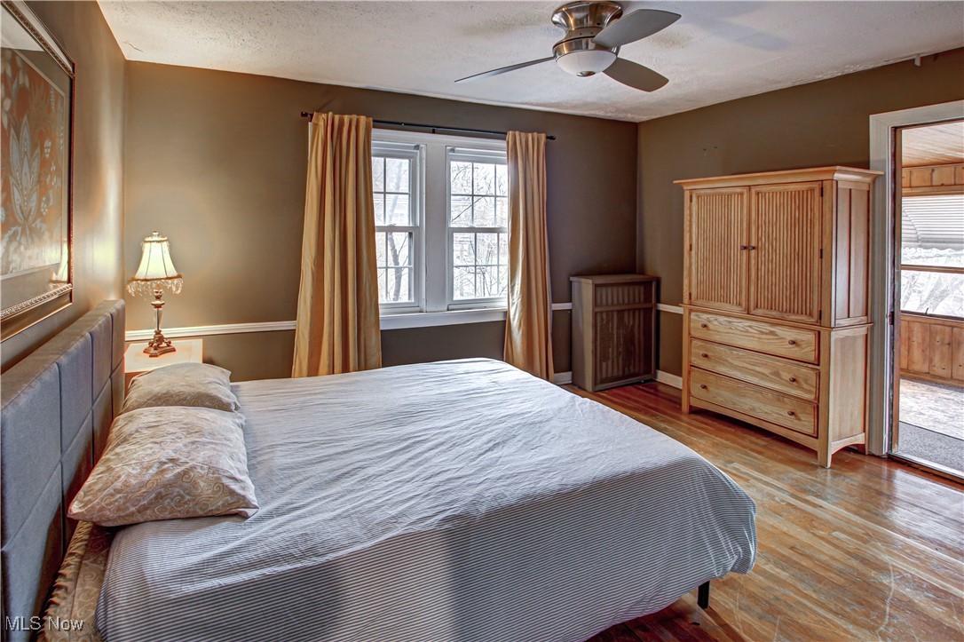 17800 Winslow Road Beachwood, OH 44122 - Photo 19 of 31 Bedroom with ceiling fan, light hardwood / wood-style flooring, and a textured ceiling