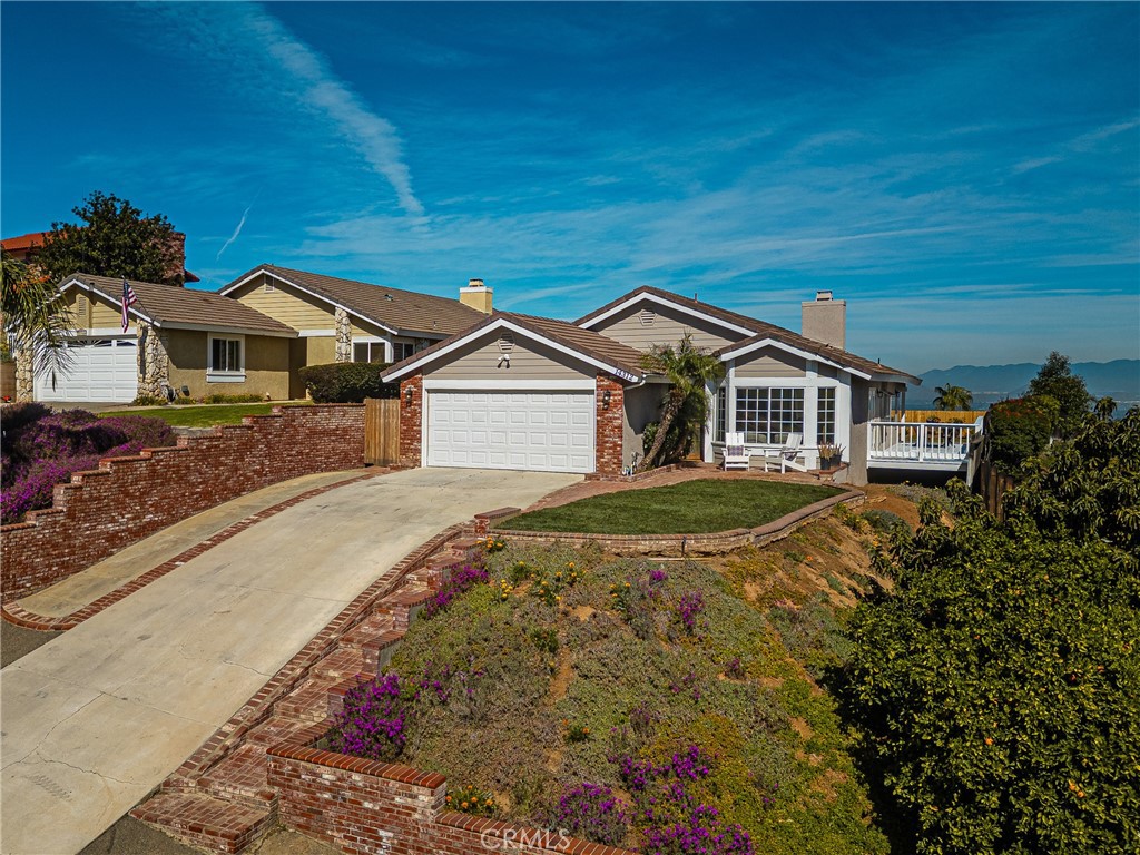 14312 Martin Riverside, CA 92503 - Photo 2 of 58 a front view of a house with a yard