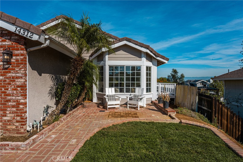14312 Martin Riverside, CA 92503 - Photo 5 of 58 a bench is sitting in front of a house