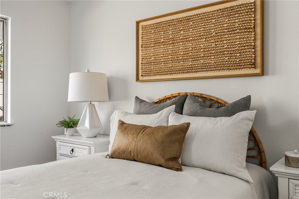 14312 Martin Riverside, CA 92503 - Photo 51 of 58 a bedroom with a bed and a lamp on table