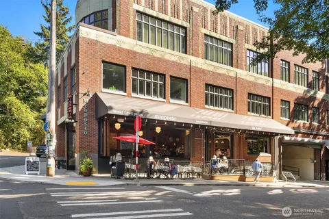 a view of a building and a people on a street