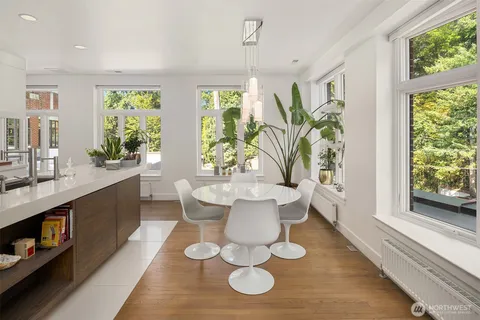 a large white kitchen with a large window