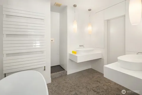 a bathroom with a bathtub and a shower