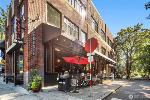 a view of a building with sitting area